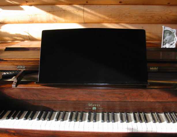 black piano music shelf